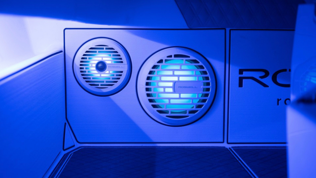 Roswell marine subwoofers in boat, glowing blue